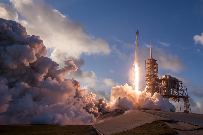 Community members watching a rocket launch together