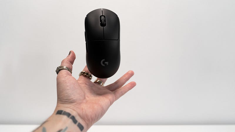 Programmer using a mouse at a desk