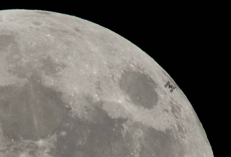 International Space Station silhouetted against the Moon