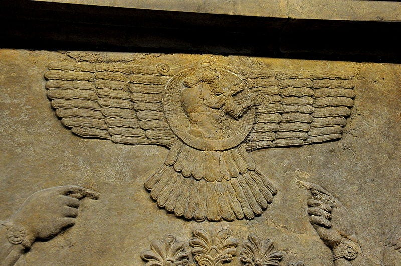 Relief depicting the god Ashur, central to Assyrian identity.